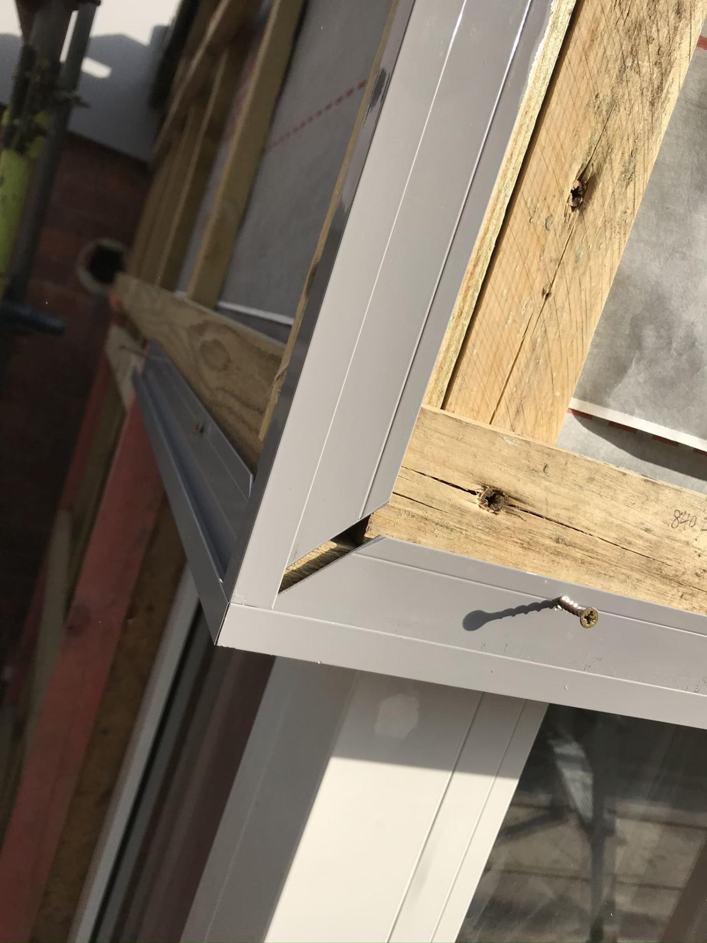 Close-up of roof or window trim detail during roofing and cladding installation