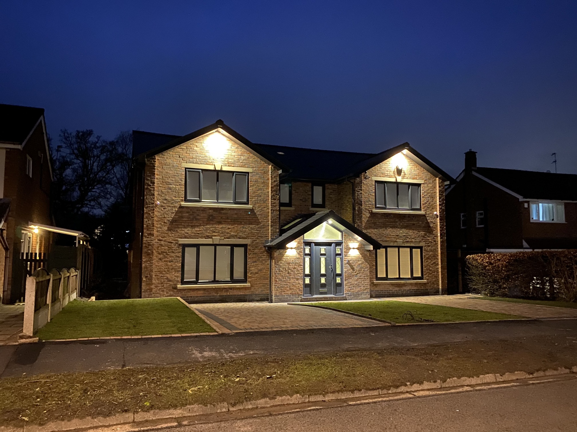 Completed detached home photographed at dusk after a full renovation project