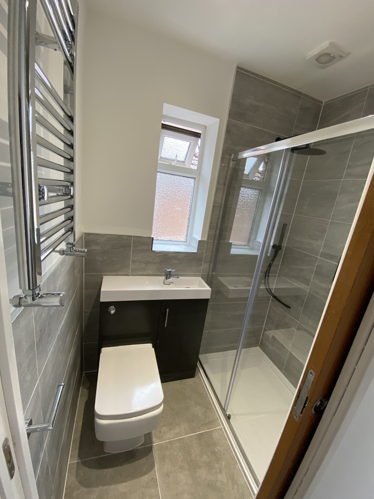 Bathroom towel radiator detail in a completed fit-out