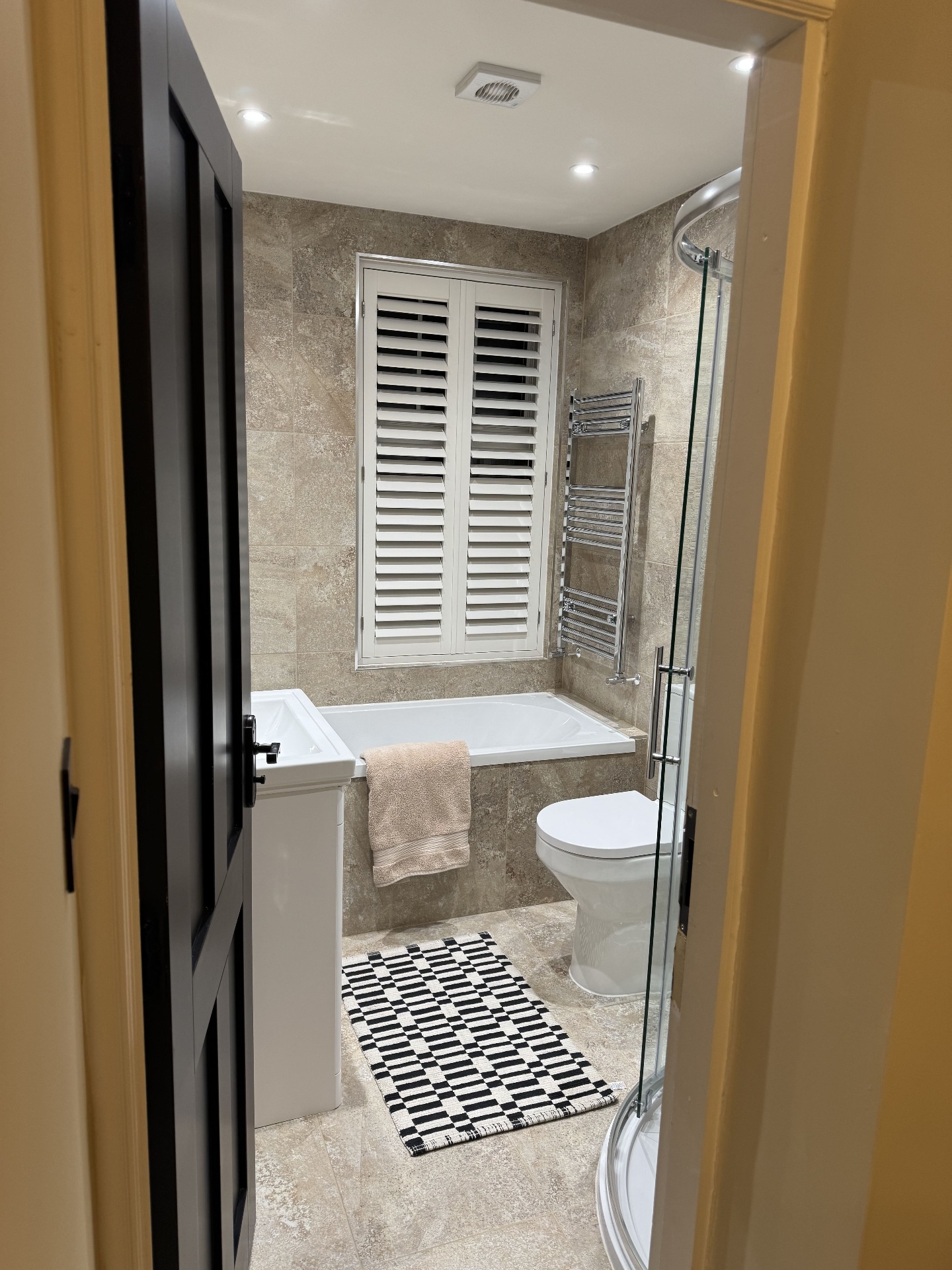 Completed shower detail with fitted screen and tiled enclosure