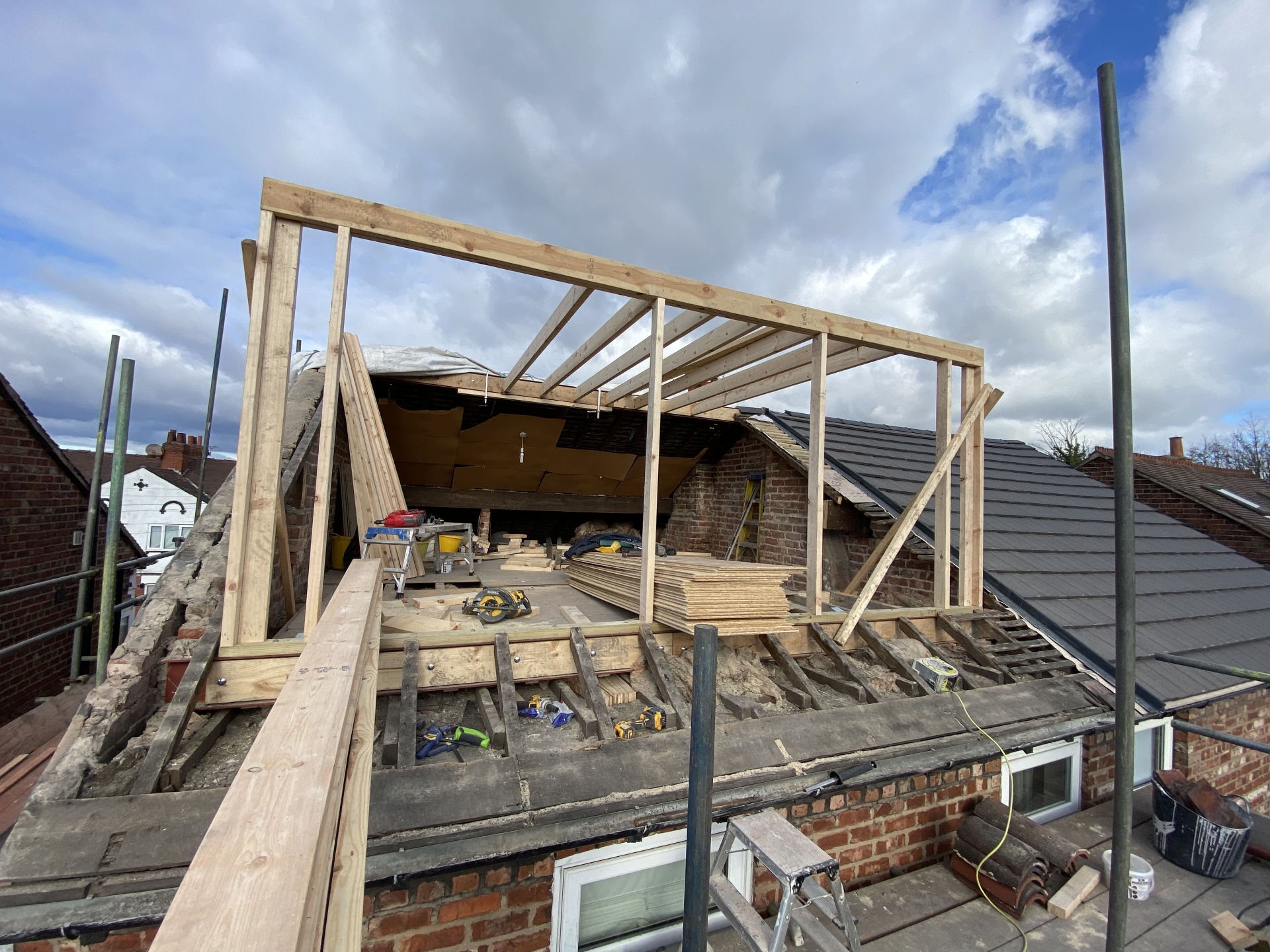 Dormer loft conversion timber frame under construction on a roof