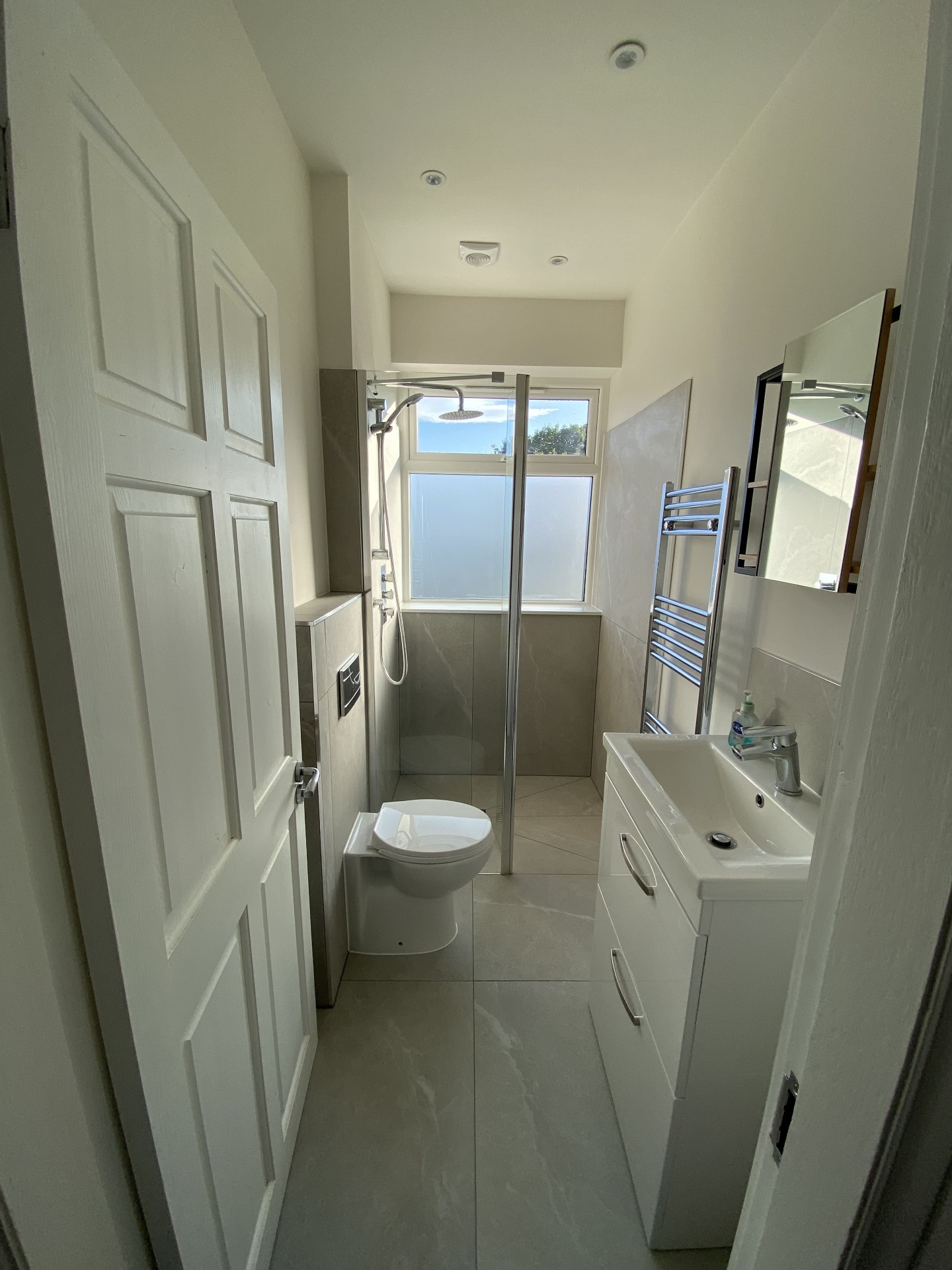 Completed hallway or bathroom approach with crisp modern finishes