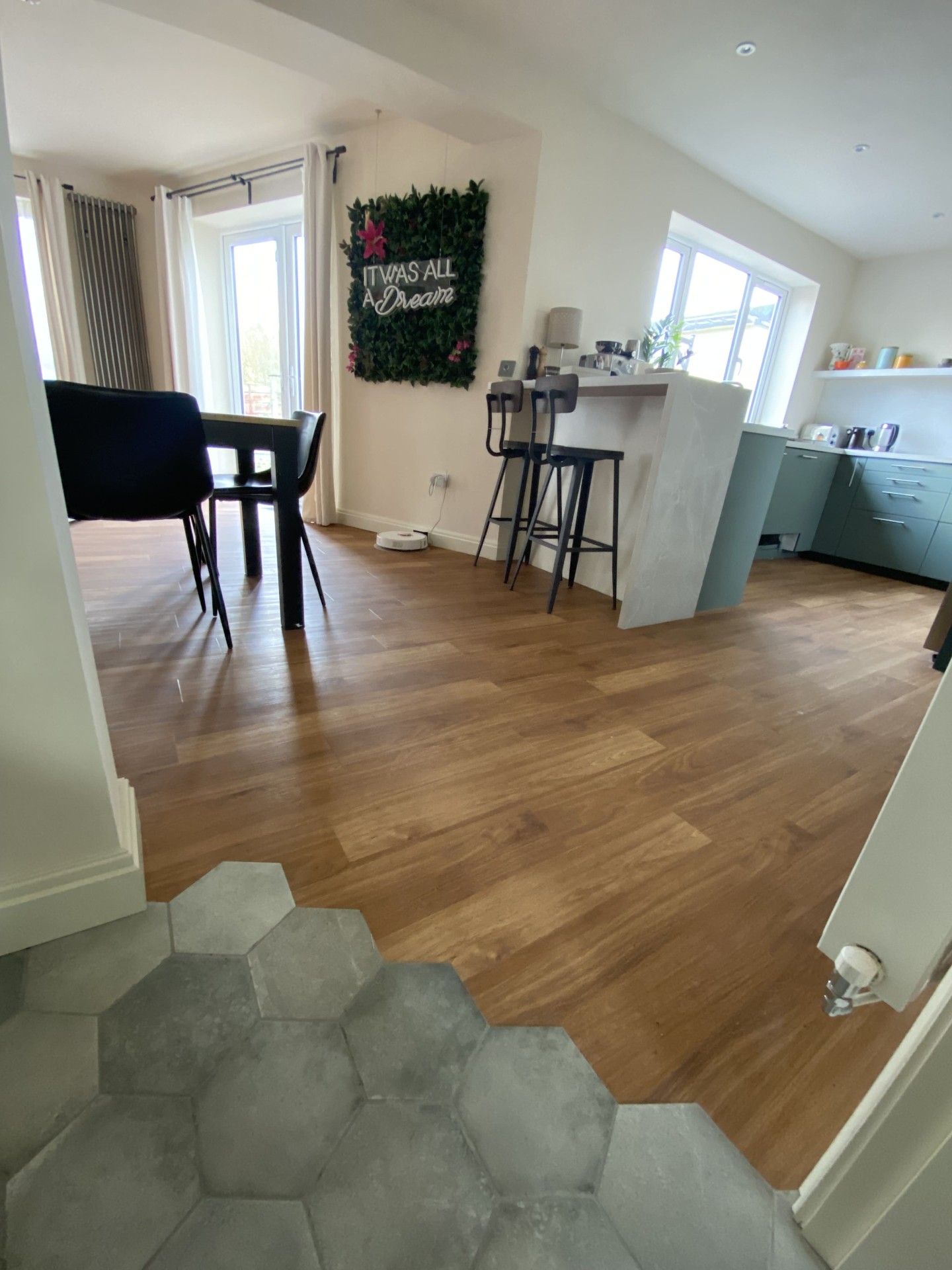 Completed open-plan kitchen with island seating and dining area