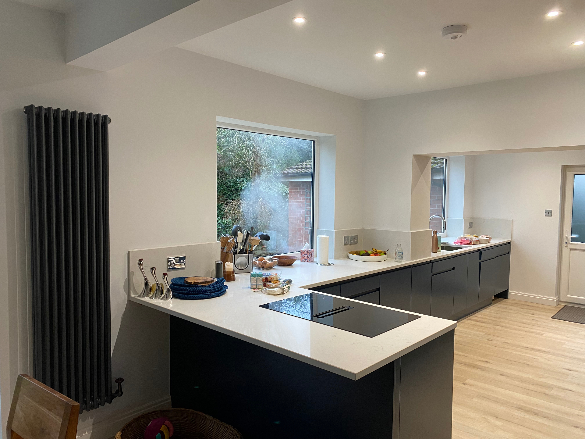 Completed contemporary kitchen with island and open-plan family layout